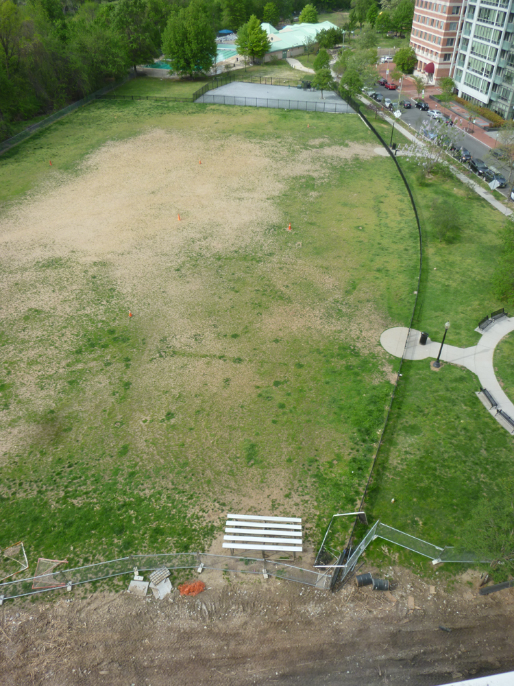 Birdseye view of field with bare dirt center